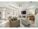Spacious living room with fireplace, large windows and light taupe sofa at 2014 Newstyle Way, Tega Cay, SC 29708