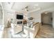 Bright living room with fireplace and hardwood floors at 2014 Newstyle Way, Tega Cay, SC 29708
