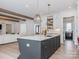 Large kitchen island with dark gray cabinetry and white countertop at 1013 Maxwell Ct # 4, Marvin, NC 28173