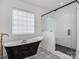 Elegant bathroom with freestanding soaking tub and patterned tile at 1013 Maxwell Ct # 4, Marvin, NC 28173