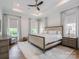 Spacious main bedroom with large bed and hardwood floors at 1013 Maxwell Ct # 4, Marvin, NC 28173