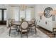 Modern dining room with large round table and stylish sideboard at 1013 Maxwell Ct # 4, Marvin, NC 28173