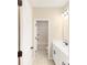 Bright bathroom with double vanity, tub, and shower at 216 E Warfield Dr, Mooresville, NC 28115