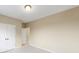 Well-lit bedroom with double-door closet and access to hallway at 216 E Warfield Dr, Mooresville, NC 28115