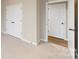 Bedroom with double doors and access to another room at 216 E Warfield Dr, Mooresville, NC 28115