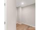 Empty basement room with wood flooring at 216 E Warfield Dr, Mooresville, NC 28115