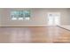 Bright living room with hardwood floors and access to backyard at 216 E Warfield Dr, Mooresville, NC 28115