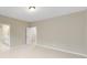 Spacious bedroom with neutral walls, carpet, and access to a bathroom at 216 E Warfield Dr, Mooresville, NC 28115