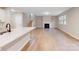 Spacious living room with hardwood floors and a fireplace at 216 E Warfield Dr, Mooresville, NC 28115