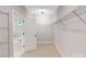 Spacious walk-in closet with wire shelving and a view of the bathroom at 216 E Warfield Dr, Mooresville, NC 28115