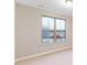 Bright bedroom with large window and neutral walls at 216 E Warfield Dr, Mooresville, NC 28115
