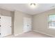 Bedroom with double doors and window at 216 E Warfield Dr, Mooresville, NC 28115