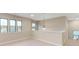 Open loft area with multiple windows and a light fixture at 216 E Warfield Dr, Mooresville, NC 28115