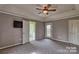 Main bedroom with carpet, ceiling fan, and access to private deck at 2726 Bluejay Rd, Heath Springs, SC 29058