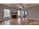 Hardwood floors, fireplace and view into kitchen and dining area at 2726 Bluejay Rd, Heath Springs, SC 29058