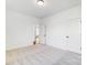 Empty bedroom with neutral carpet, white walls, and open doorway at 3206 Whispering Creek Dr # 159, Indian Trail, NC 28079