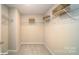 Spacious walk-in closet with wire shelving and neutral carpeting at 113 Saidin Ln, Troutman, NC 28166