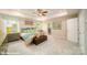 Main bedroom with teal bedding, ceiling fan, and ensuite bathroom at 139 Saidin Ln, Troutman, NC 28166