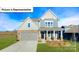 Two story home with gray siding and stone accents at 109 Saidin Ln, Troutman, NC 28166