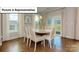 Bright dining room features hardwood floors and a table with seating for six at 133 Saidin Ln, Troutman, NC 28166