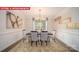 Elegant dining room featuring hardwood floors and gold accents at 147 Saidin Ln, Troutman, NC 28166