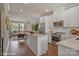 Open concept kitchen with island, stainless steel appliances, and hardwood floors at 3016 Loso Ter # 53, Charlotte, NC 28217
