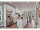 Spacious kitchen with island, stainless steel appliances, and white cabinetry at 3016 Loso Ter # 53, Charlotte, NC 28217