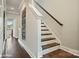 Modern staircase with dark hardwood steps and white risers at 3016 Loso Ter # 53, Charlotte, NC 28217