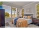 Bright bedroom with large windows, a queen bed, and wood flooring at 3016 Loso Ter # 53, Charlotte, NC 28217