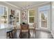 Bright breakfast nook with glass table and woven chairs, near sliding door at 3016 Loso Ter # 53, Charlotte, NC 28217