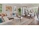 Cozy living room with sectional sofa, area rug, and large windows at 3016 Loso Ter # 53, Charlotte, NC 28217