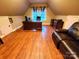 Home office with hardwood floors, large desk and leather couch at 5915 Windy Knoll Ln, Mint Hill, NC 28227