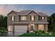 Two-story home with brick and siding exterior, two-car garage, and landscaping at 216 E Warfield Dr, Mooresville, NC 28115
