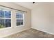 Well-lit bedroom with carpet and two large windows at 466 Tremont Ave, Charlotte, NC 28203