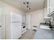 White kitchen with gray countertops and a gas range at 343 Wakefield Dr # C, Charlotte, NC 28209