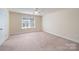 Simple bedroom with ceiling fan and window at 1994 Quill Ct, Kannapolis, NC 28083