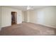 Well-lit bedroom with carpet and access to bathroom at 1994 Quill Ct, Kannapolis, NC 28083