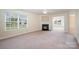 Living room featuring a fireplace and neutral carpeting at 1994 Quill Ct, Kannapolis, NC 28083