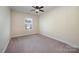Bright bedroom with ceiling fan and window at 1994 Quill Ct, Kannapolis, NC 28083