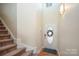 Entryway with staircase and an oval-shaped front door at 1994 Quill Ct, Kannapolis, NC 28083