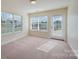Cozy bedroom with carpet flooring and access to a patio at 1994 Quill Ct, Kannapolis, NC 28083