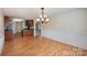 View of the kitchen and dining room with hardwood floors at 1994 Quill Ct, Kannapolis, NC 28083
