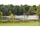 Tranquil lake view with lush greenery at 3327 Flagler Cir, Midland, NC 28107