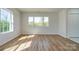 Well-lit bedroom with large window and hardwood floors at 1005 W Cabaniss Rd, Shelby, NC 28150