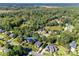 Aerial view of house and surrounding neighborhood, including a pond and lush greenery at 2029 Landry Ln, Rock Hill, SC 29732