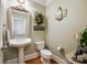 Charming bathroom with pedestal sink, toilet, and decorative accents at 2029 Landry Ln, Rock Hill, SC 29732