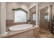 Elegant bathroom with oval soaking tub and walk-in shower at 2029 Landry Ln, Rock Hill, SC 29732