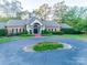 Brick community clubhouse with a circular driveway and landscaping at 2029 Landry Ln, Rock Hill, SC 29732