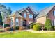 Brick home with landscaping, a fountain, and a large front yard at 2029 Landry Ln, Rock Hill, SC 29732