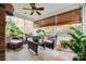 Relaxing screened porch with wicker furniture and brick flooring at 2029 Landry Ln, Rock Hill, SC 29732